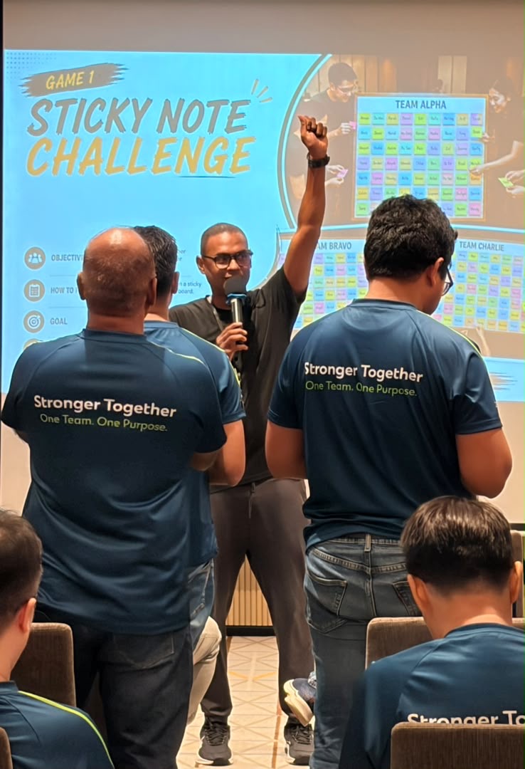 Adam facilitating a Sticky Note Challenge team-building activity